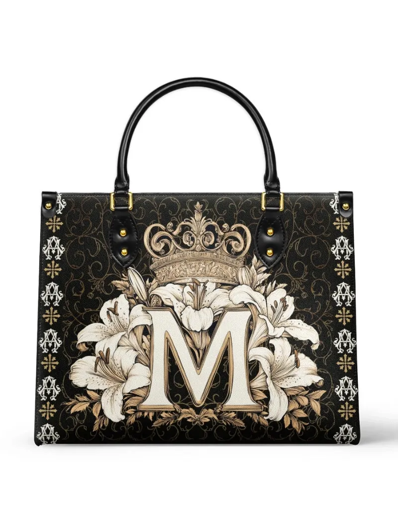 Catholight The Divine Monogram Leather Bag with M monogram, lilies, and golden crown