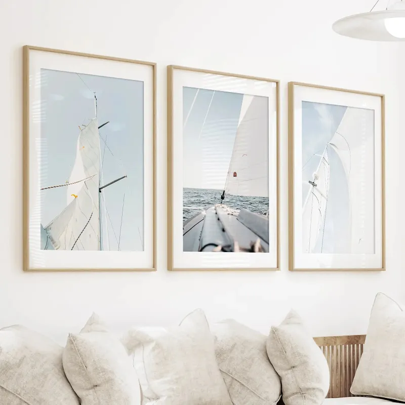 Wall Art Set Coastal Sailboat Wall Art Set of 3 showing three framed nautical sailing prints