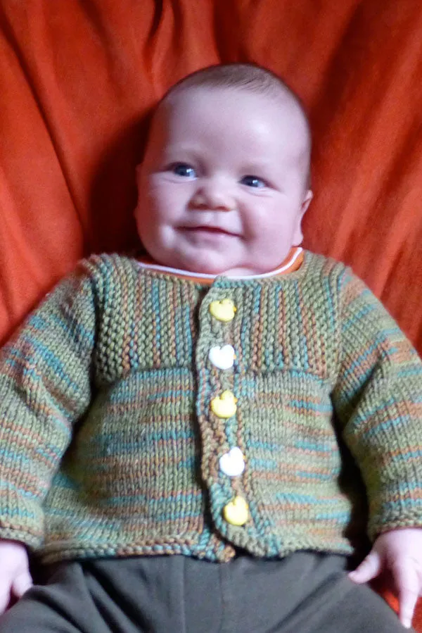 Kristen TenDyke Muddy Duck Pond Cardigan knitting pattern showing baby sweater with buttons
