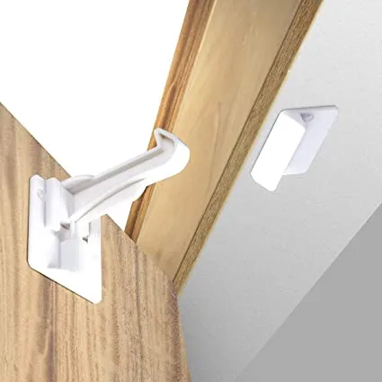 Benny Bradley's Invisible Cabinet Latch Locks installed inside a kitchen cabinet door