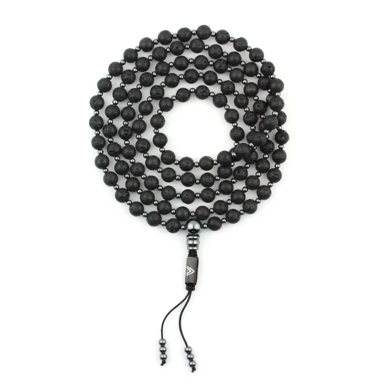 VOLTLIN Lava Stone Mala necklace on black suede pouch showing matte black stone beads