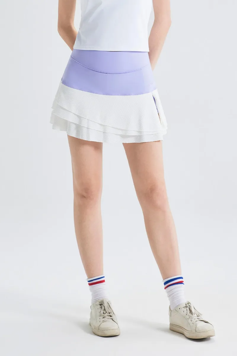 SALTUM Layered Contrast Tennis Skirt with color-blocked waistband and pleated hem