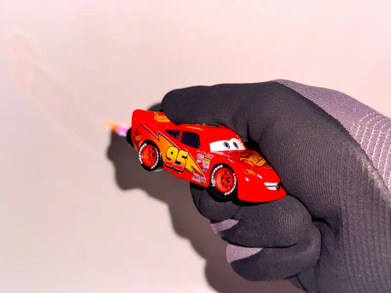 SoCal Divinity Lightning McQueen Refillable Lighter showing handmade custom automotive collectible
