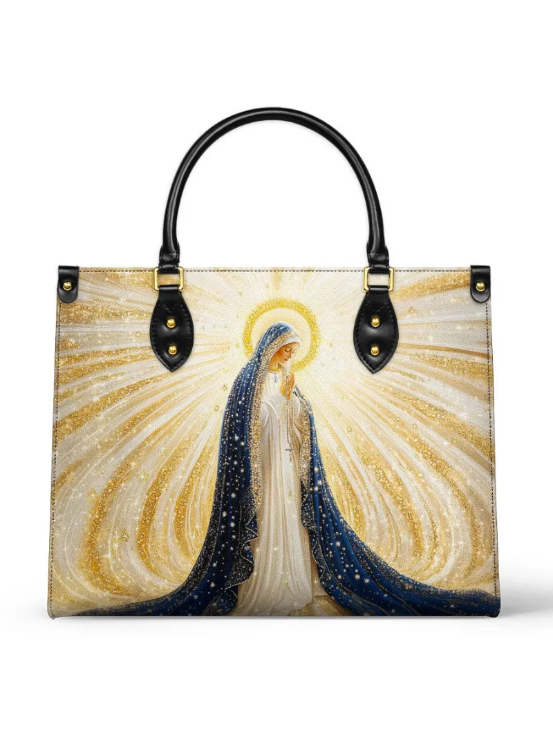 Catholight Our Lady's Eternal Glow Leather Bag showing Blessed Virgin Mary artwork with golden rays on premium leather
