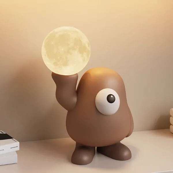 Juwas Big-eyed Monster Night Light - brown resin monster-shaped night light on a surface