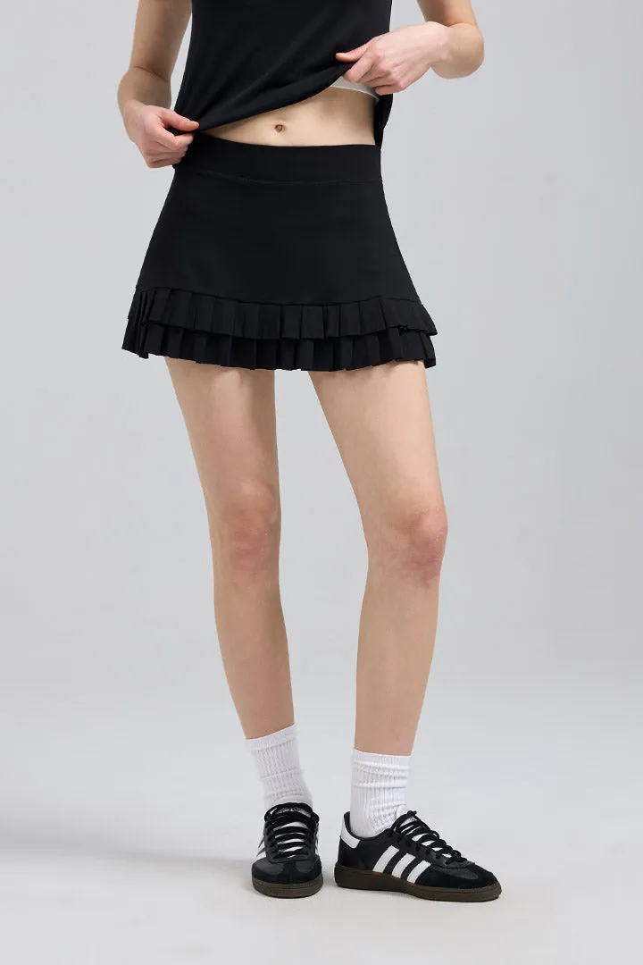SALTUM Double Pleated Mini Skirt in high-waisted pleated design