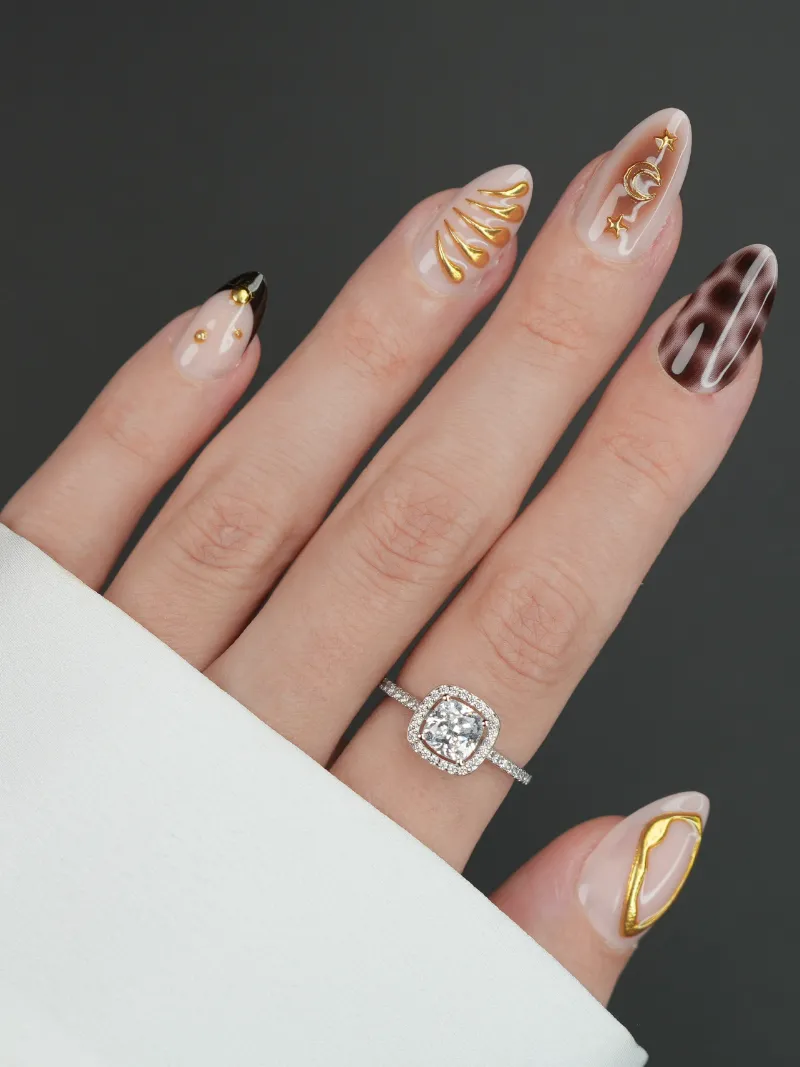 Roxy Nails Paris Ancient spell press-on nails with 3D mystical talisman designs in black and gold