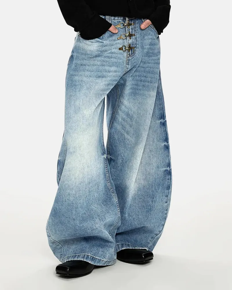 INFLATION Acid Washed Whisker Clasp Barrel Jeans in blue denim with cat's whisker fading and metal clasp