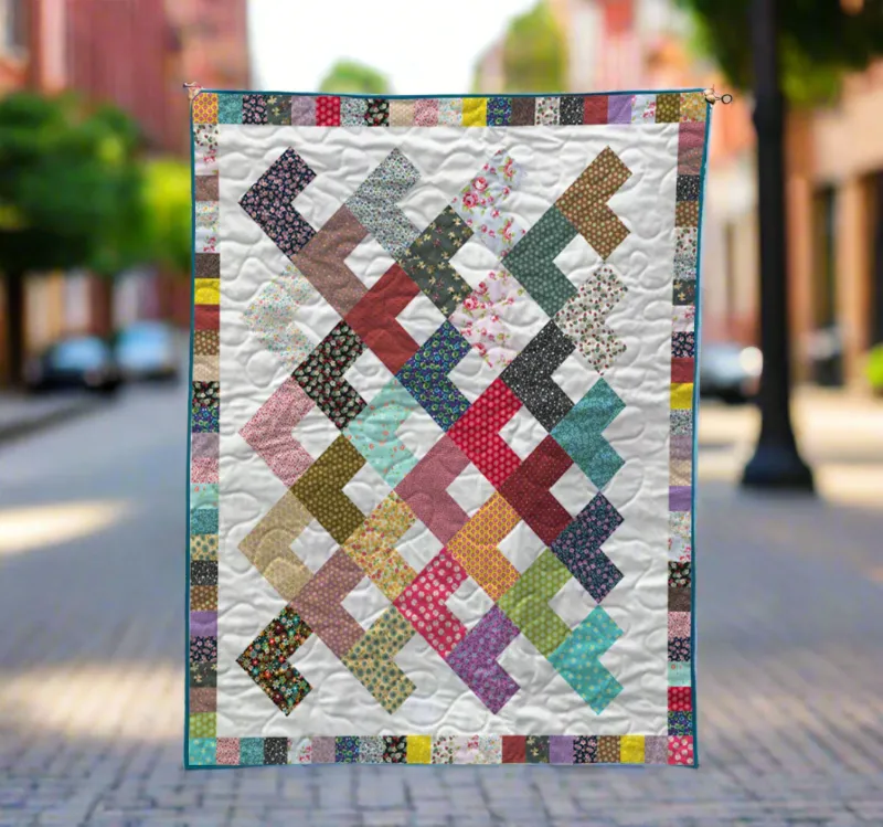 Boho Blanket Bright Angles Quilt Pattern, a geometric quilt design with bold layered angles