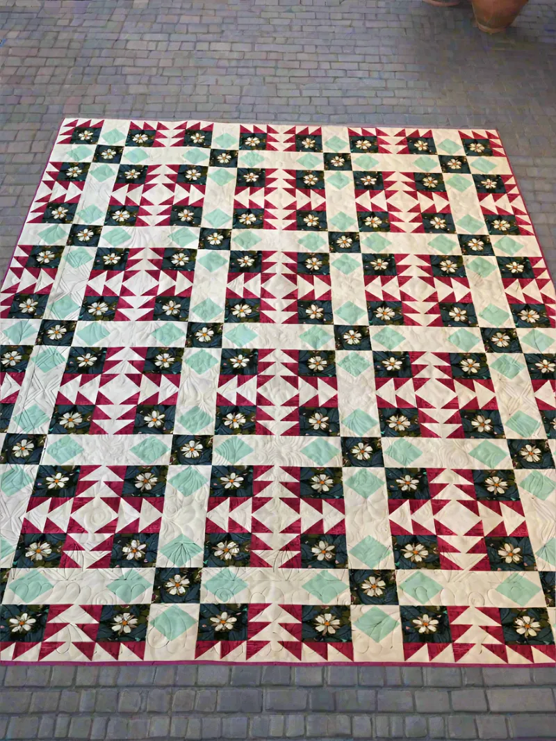 Boho Blanket Magical Medallions Quilt Pattern, a quilt with layered medallion-style blocks in mixed fabrics