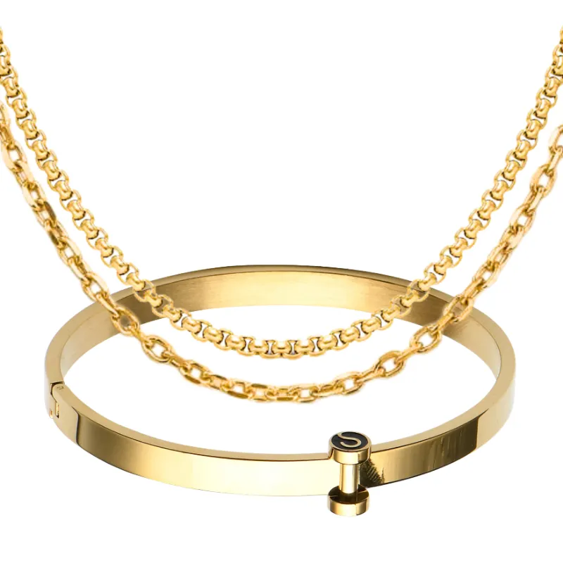 Sleek Fit Jewelry Essential Set Gold, gold chain necklaces and a bangle bracelet arranged together