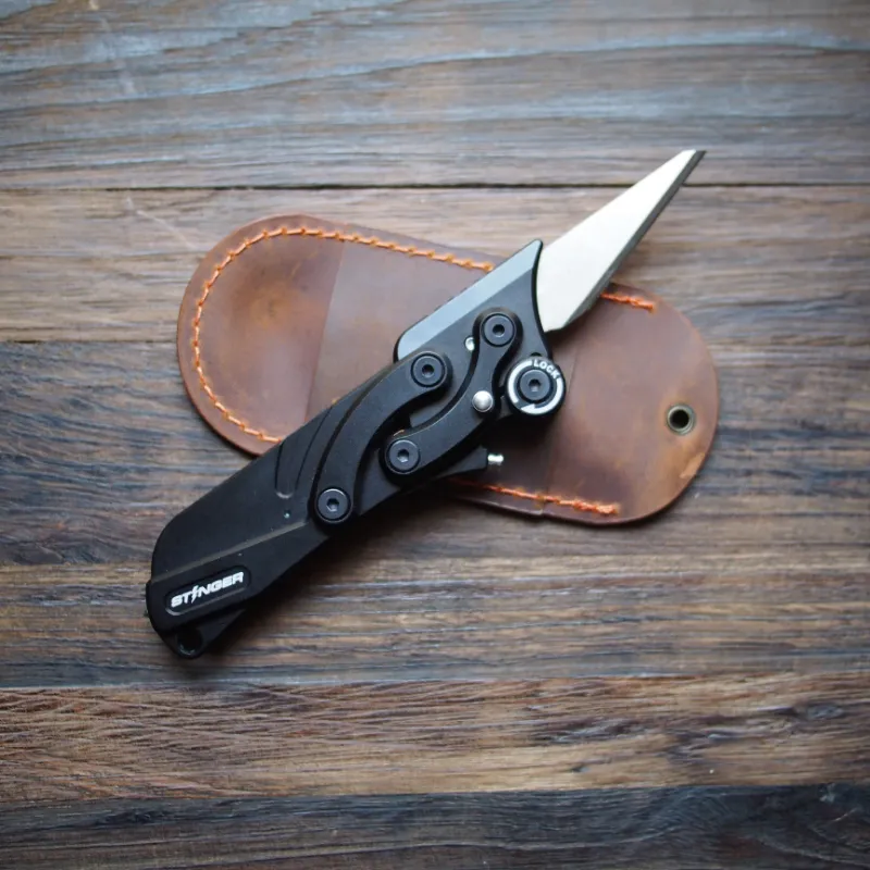 The Stinger Tools Stinger Olfa Evolution Blade with Leather Pouch, matte black folding knife with pouch