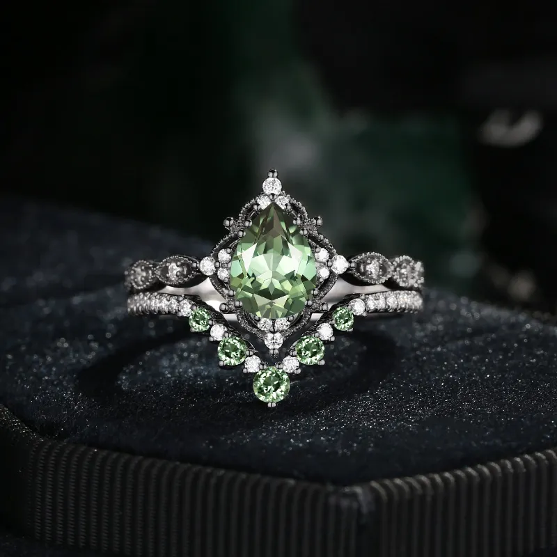 Starlandus Elara Antique Pear Cut Lab Green Sapphire Engagement Ring Set in black gold