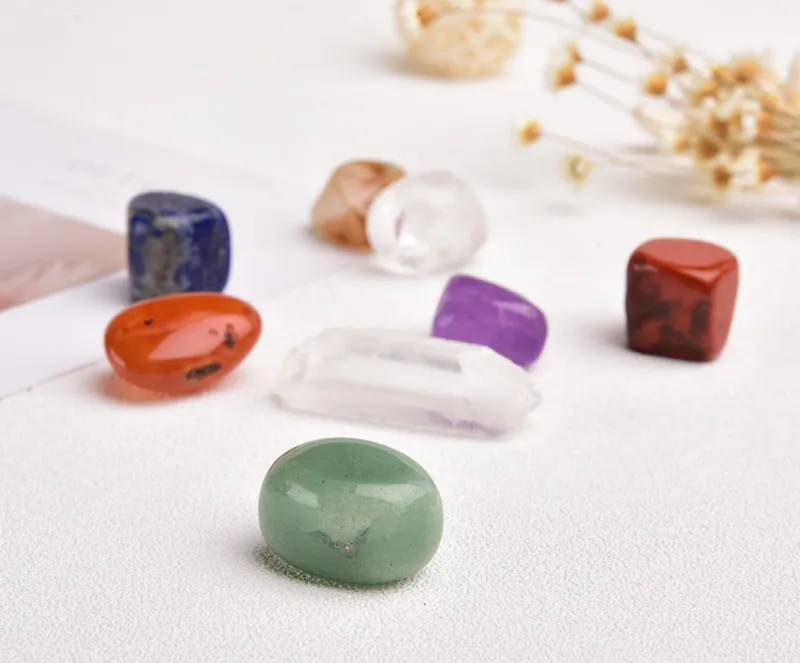 Turix 7 Chakras Tumbled Crystal Set showing seven polished stones and one raw Clear Quartz point