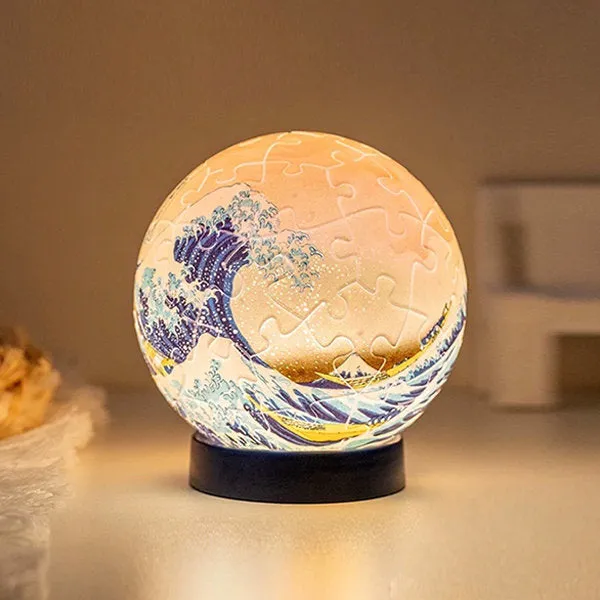 Juwas 3D Puzzle Light Ball showing assembled glossy plastic segments with internal LED glow