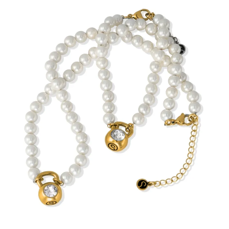 Sleek Fit Jewelry Pearl Set - Gold with white pearl necklace and bracelet in 14k gold on a plain background