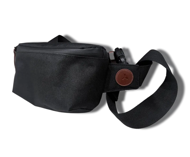 Airvape Smell Proof Beach Bum Bag worn as a crossbody belt bag on a beach outing