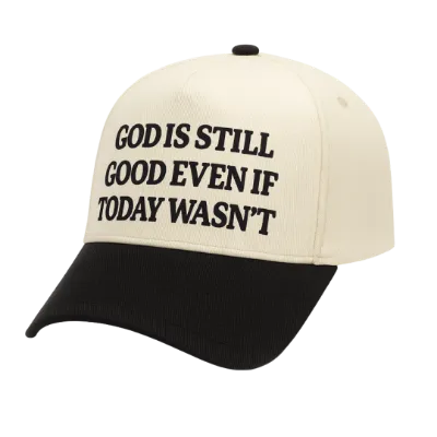 We The Believers God Is Still Good Even If Today Wasn't 5 Panel Embroidered Hat showing a cream and black trucker hat