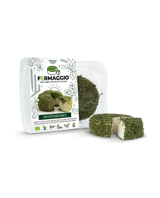 Vegaliano Aged Mediterraneo Herbs Cheese, sliced showing herb flecks