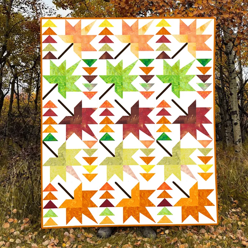 Boho Blanket Autumn Whispers Quilt Pattern, a graphic tree-ring quilt design shown in layered autumn fabrics