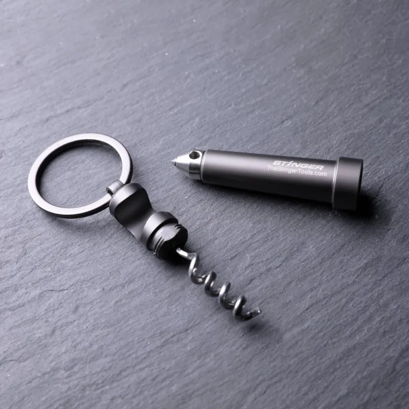 The Stinger Tools Stinger Multi-Tool Keyring with Glass Breaker, small steel tool with bottle opener and glass breaker