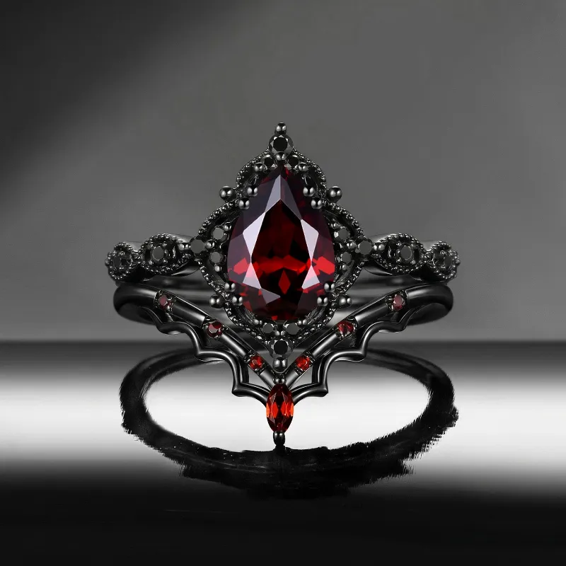 Starlandus 'Bat's Whisper' Gothic Pear Cut Garnet Alternative Bridal Engagement Ring Set with Bat Wings in Black Gold