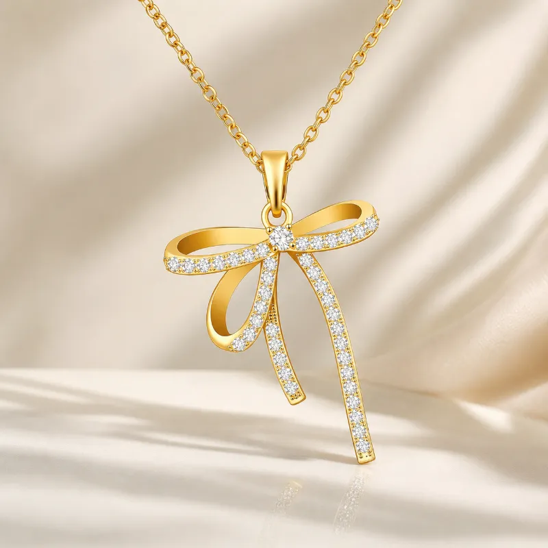 Viva Koutour Cosmetics Golden Bow Necklace gold bow pendant cubic zirconia