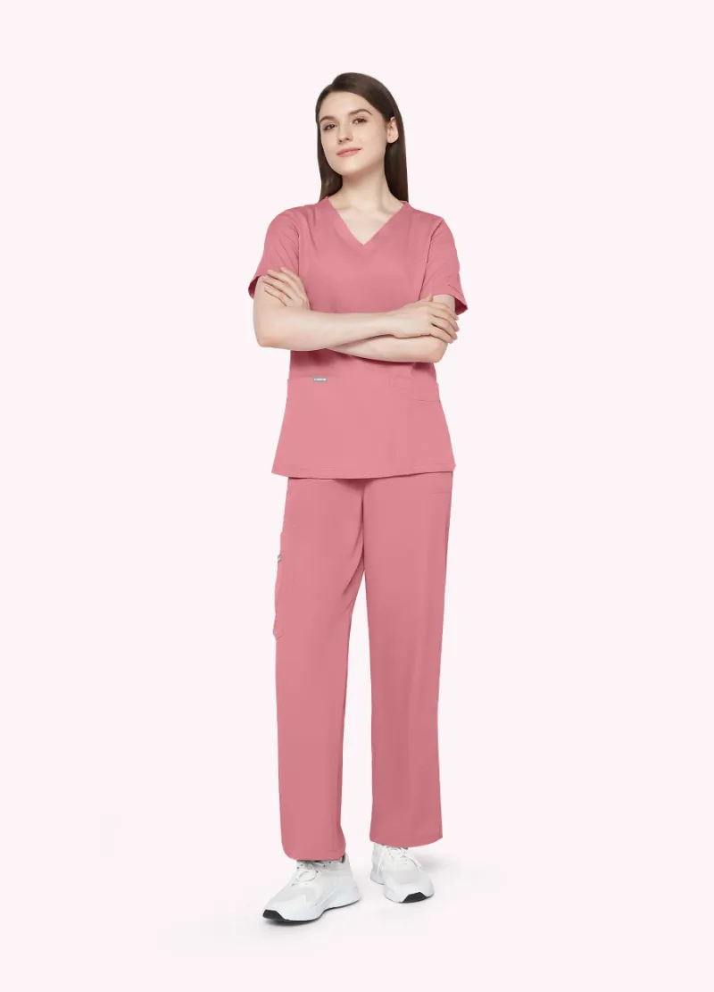 COMENII StyleFlex 10-Pocket Essential Scrub Set in Pink, front view showing V-neck top and cargo pants