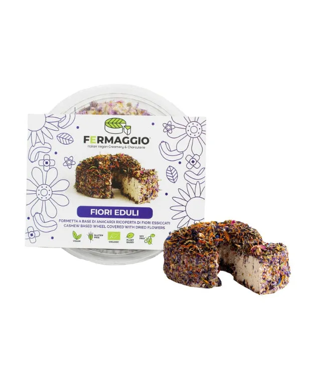 Vegaliano Aged Cheese with Flowers showing creamy aged cashew cheese topped with colorful edible flower petals