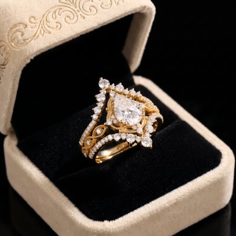 Starlandus Elara vintage pear cut moissanite engagement ring set with milgrain detailing