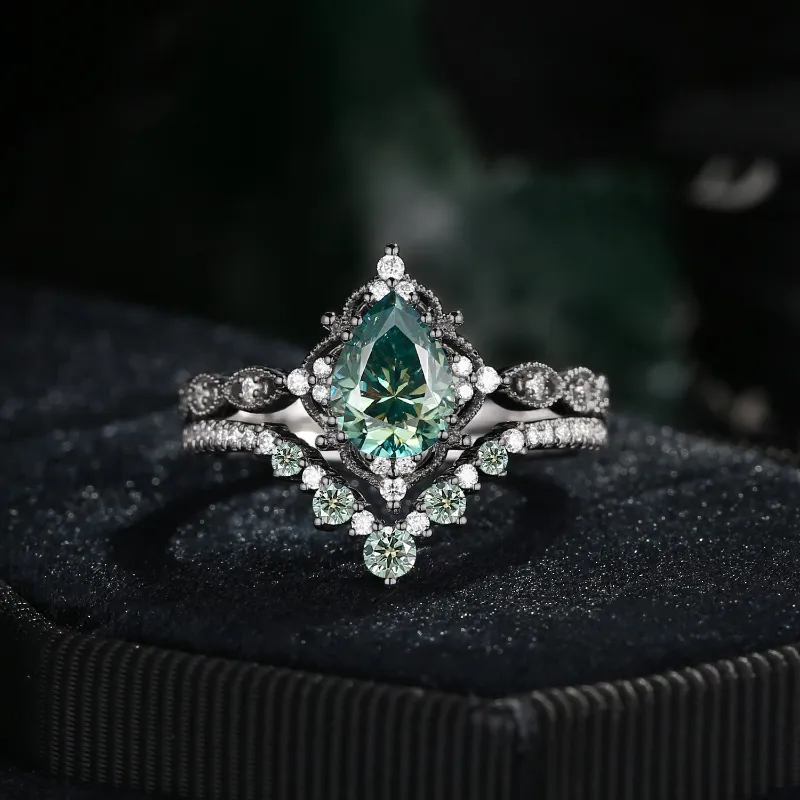 Starlandus Elara Antique Pear Cut Green Moissanite Engagement Ring Set in black gold