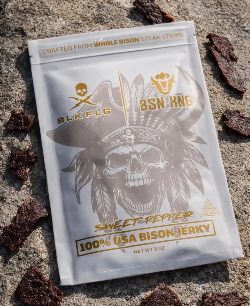 BLK FLG BSN KNG Bison Jerky bag shown next to sliced bison jerky strips