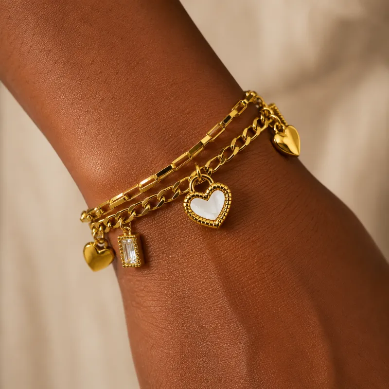 Viva Koutour Cosmetics Amour Luxe Layered Charm Bracelet with heart charms and gold plating