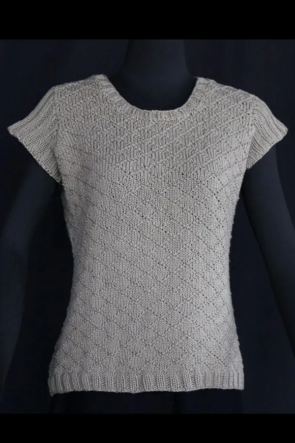 Kristen TenDyke Njord Pullover knitting pattern showing seamless sweater with diamond motif