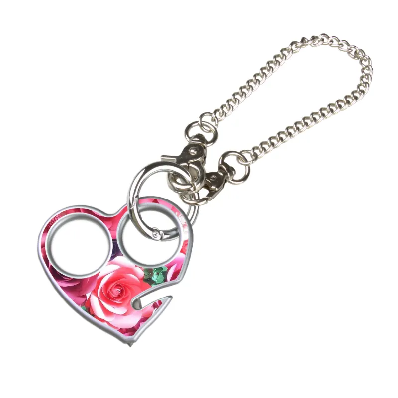 The Stinger Tools Stinger Sweetheart Self-Defense Keychain with glass breaker and seatbelt cutter hanging from rearview mirror