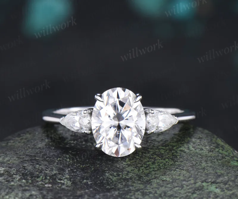 WillWork Jewelry 2ct oval cut moissanite engagement ring three stone pear moissanite accent promise ring gifts for her, displayed on ring st