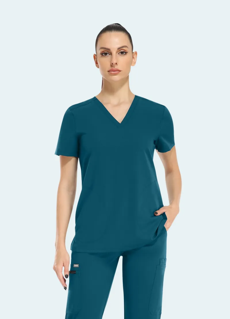 COMENII ElegCare™ Slim Scrub Top Caribbean Blue, front view showing slim fit and hidden pocket design