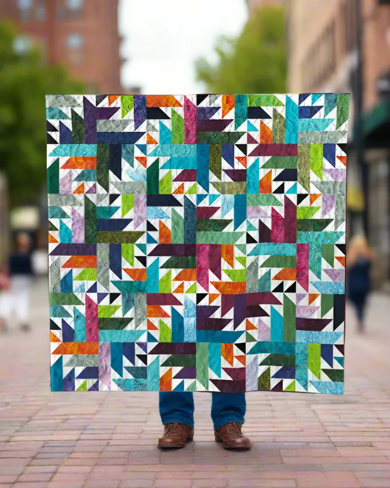 Boho Blanket Enchanted Garden Quilt Pattern cover showing a bold graphic quilt in layered colors