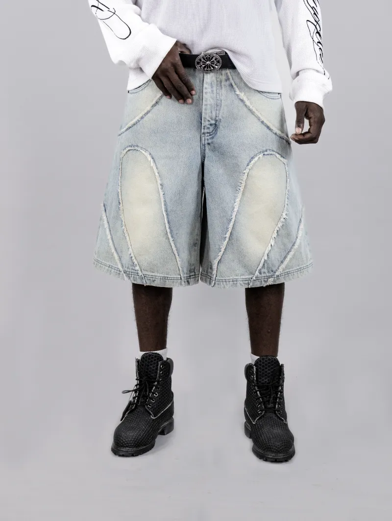 ARNTREAL Arnmor Blue Jorts in wash blue denim with logo cutouts and fringe finish