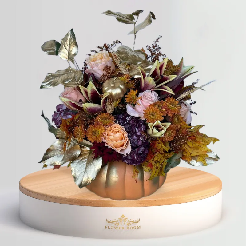 Flower Boom Dallas Golden Pumpkin arrangement with fresh roses and calla lilies in a pumpkin