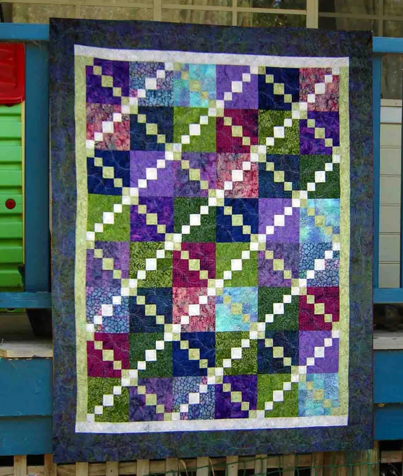 Boho Blanket Bed of Roses Quilt Pattern, a rose-themed quilt shown in a square layout