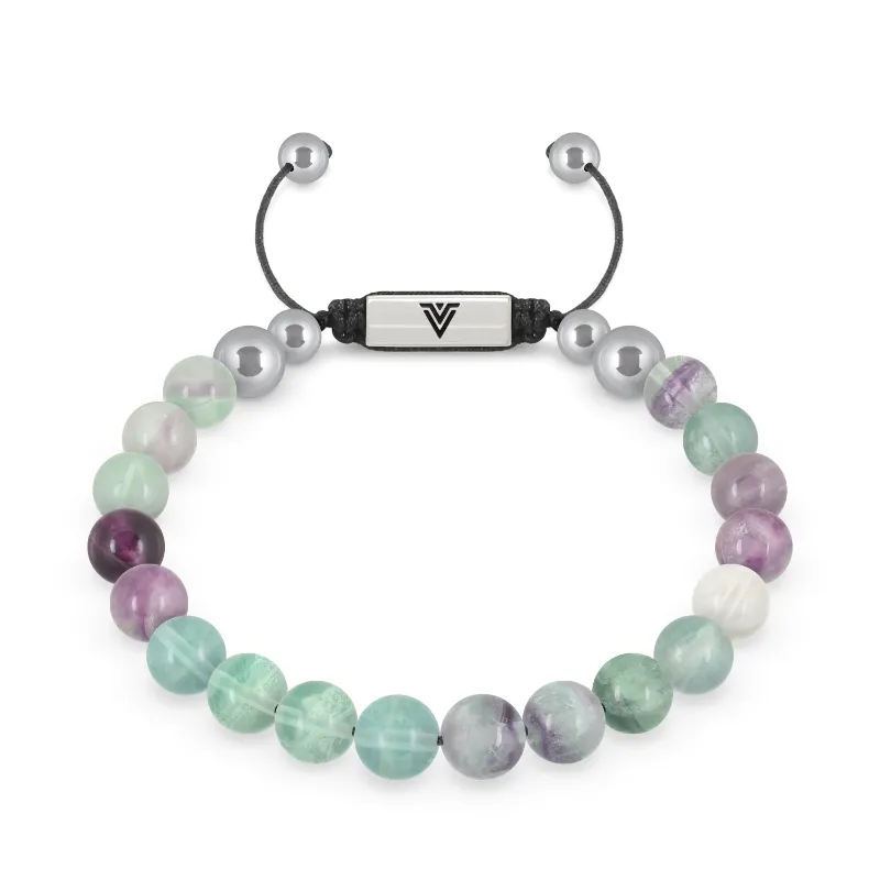 VOLTLIN Fluorite Shambala Bracelet on a black suede pouch showing green and purple stone beads