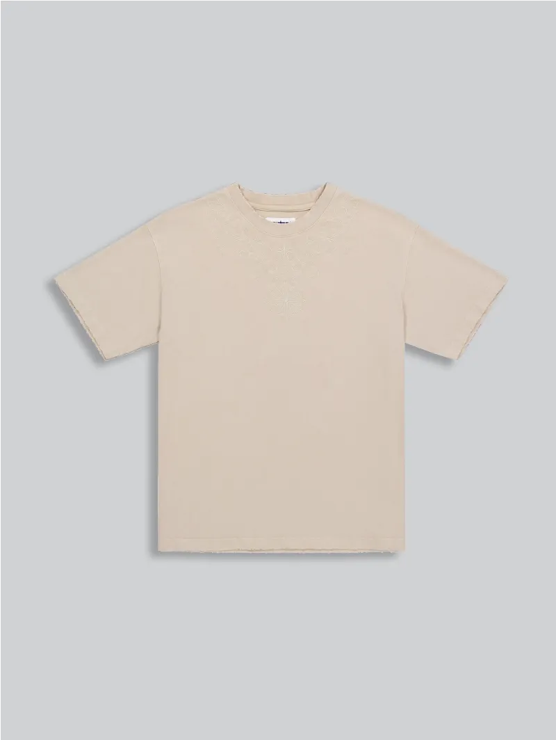 ARNTREAL Holy T-shirt in sand with embroidered collar detail and relaxed fit