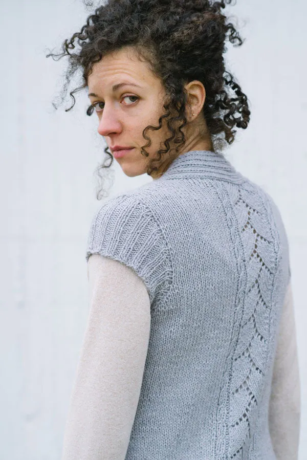 Kristen TenDyke Kanti Mama knitting pattern showing a cardigan with lace and cable panel details