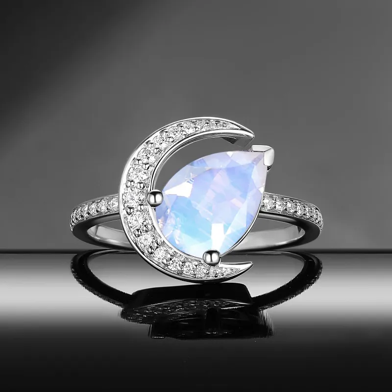 Starlandus Moonlit Reverie tilted pear natural moonstone crescent moon engagement ring