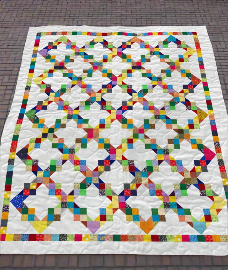 Boho Blanket Linked Rainbows Quilt Pattern, cover showing linked rainbow arcs in a quilt