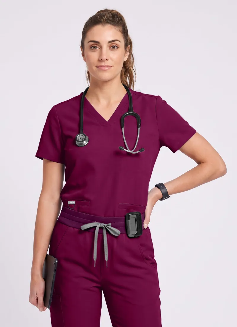 COMENII SoftTouch 3 Pockets Scrub Top in wine red with v-neck and pocket details