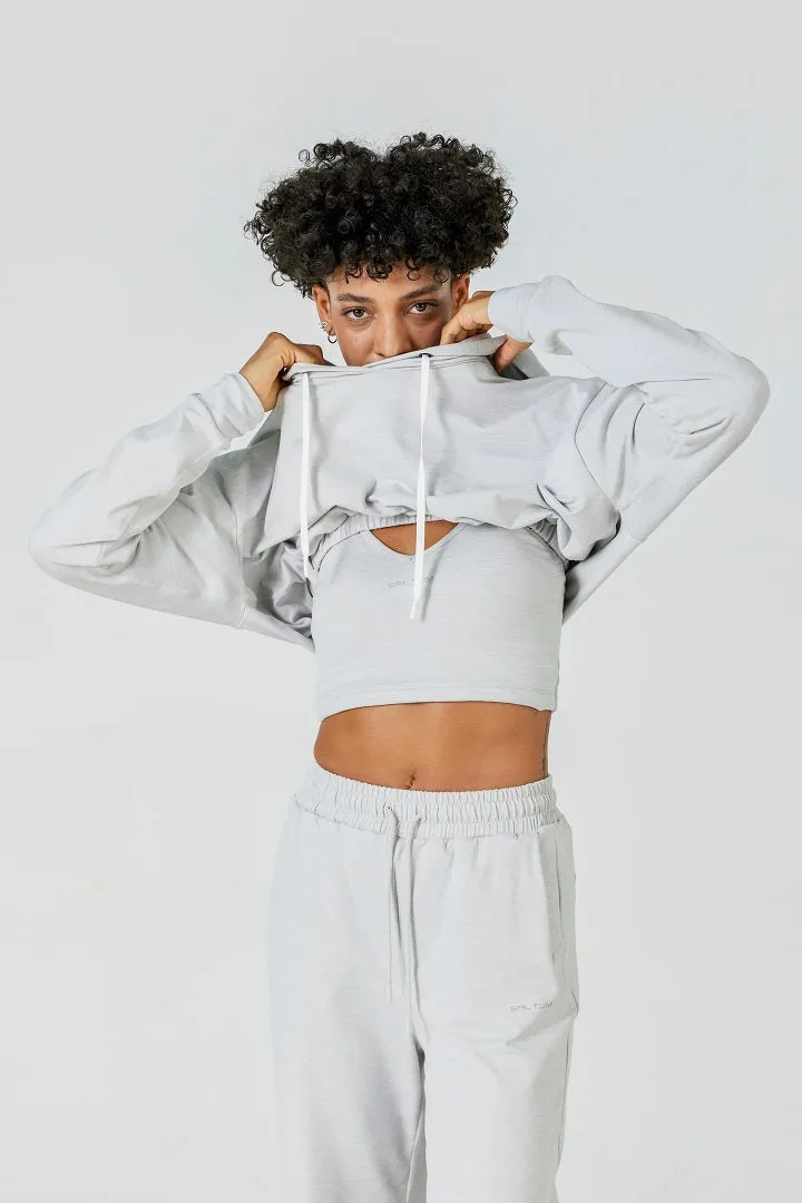 SALTUM CloudFleece™ Cropped Pullover Hoodie in light flecked grey with drawstring hood and ribbed trim