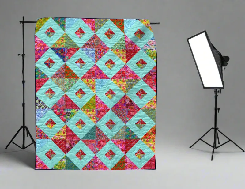 Boho Blanket Blooming Jewels Quilt Pattern, a tree-ring inspired quilt design with layered texture and colour