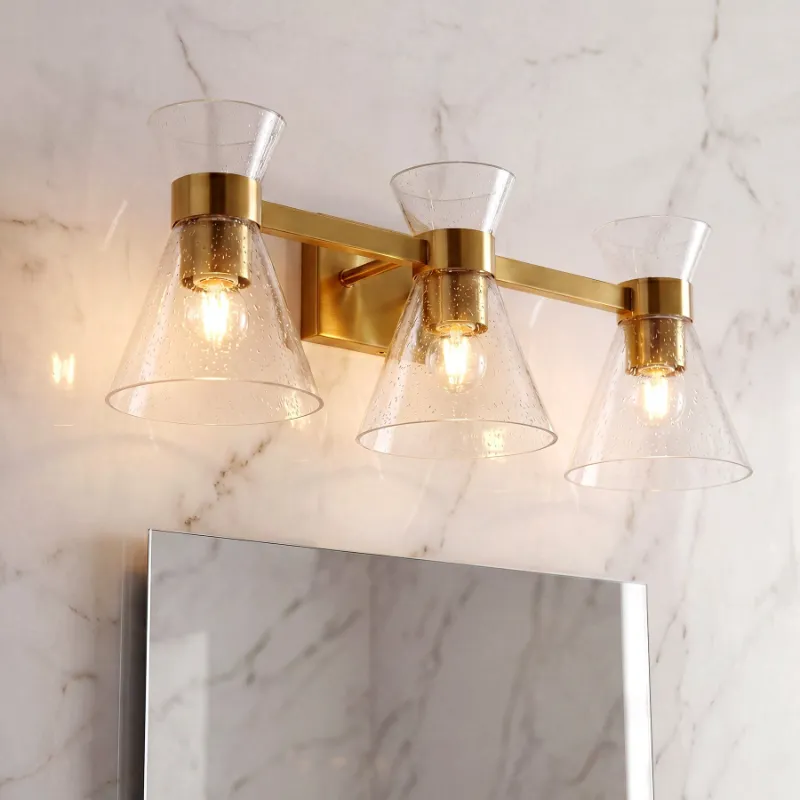 Tribesigns 3-Light Bathroom Vanity Light with brushed brass finish and seeded glass shades